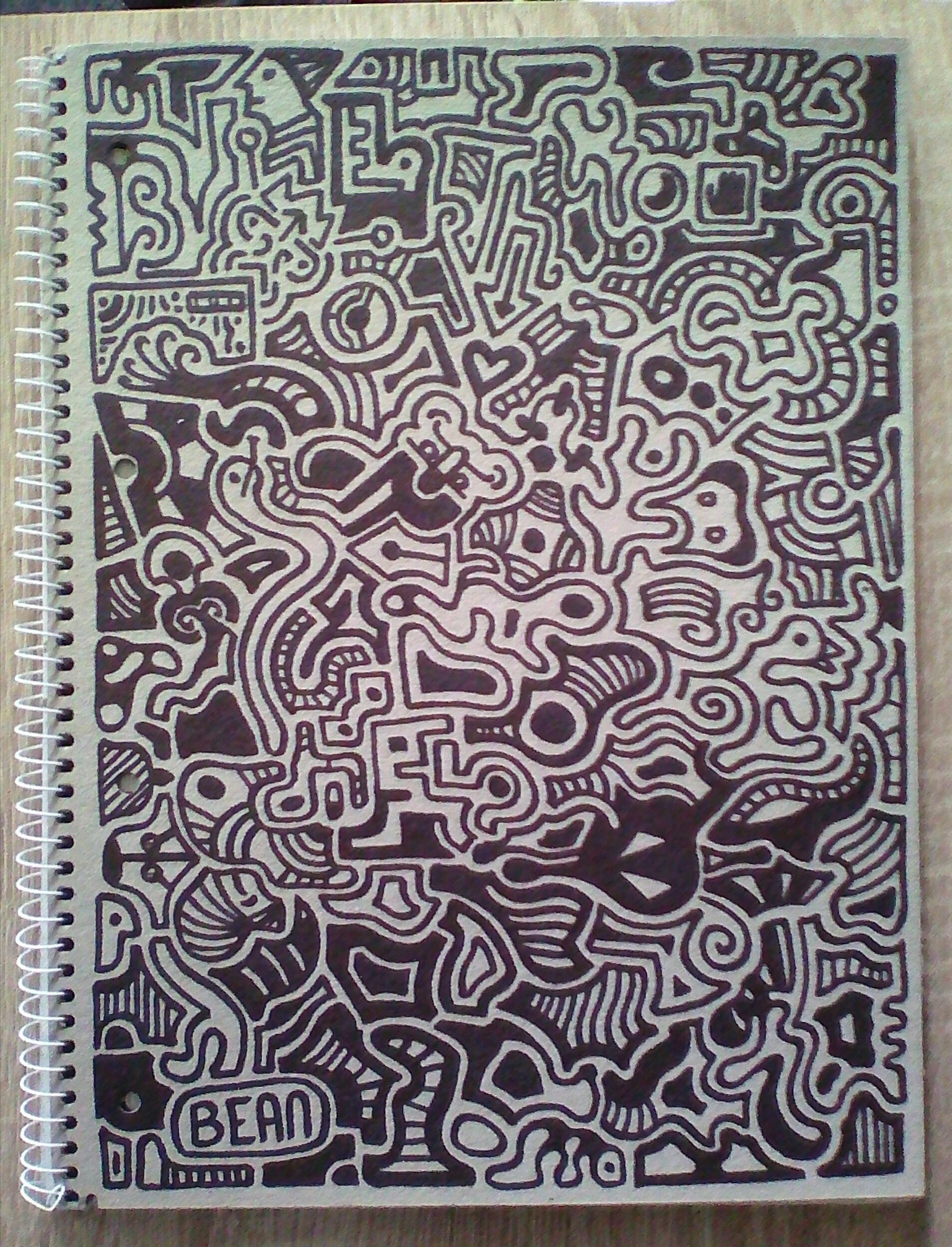 back cardboard cover of a ringbook covered with abstract doodles