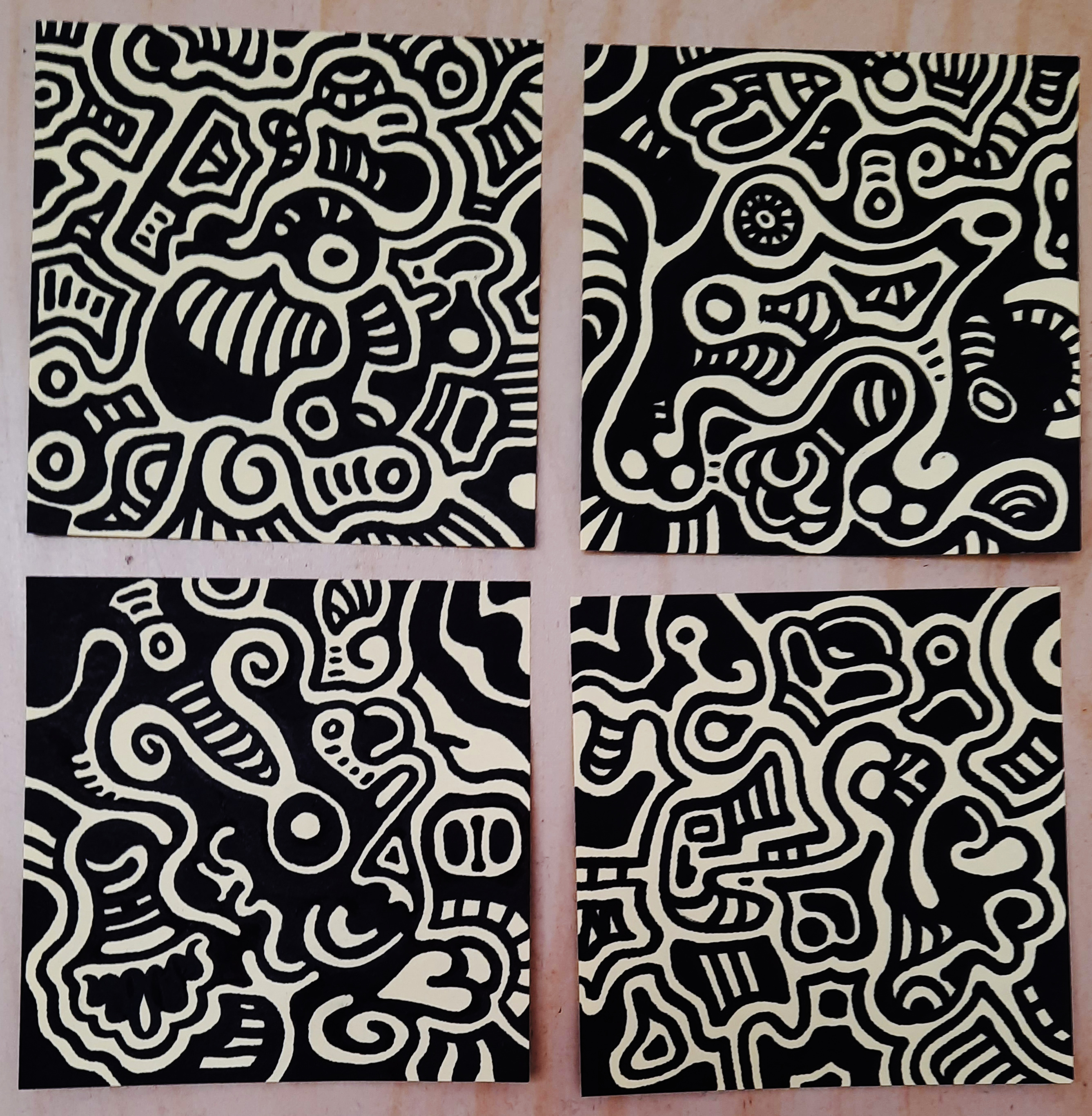 4 post it notes covered in swirly doodles